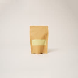 Sachet en papier kraft brun transparent contenant de la poudre naturelle de Pierre Jaune By Sibyllete.